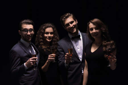 company fashionable friends ,with a glass of wineの写真素材