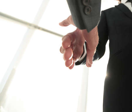 Two  business men going to make handshakeの写真素材