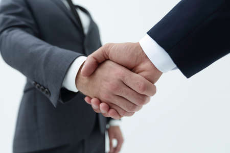 Businessman by handshake invites to cooperation.の写真素材