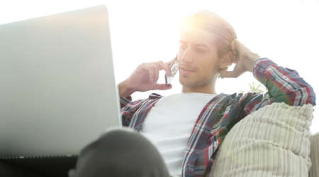 close-up of a successful guy talking to a smartphone