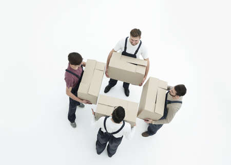 Delivery men with cardboard boxes on white background.の写真素材