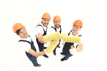 view from the top.a group of decorators with a paint roller