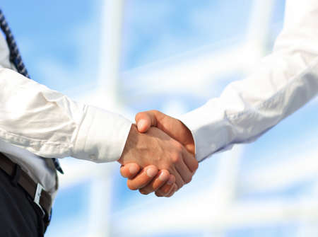 Close-up photo of handshake of two successful businessmenの写真素材