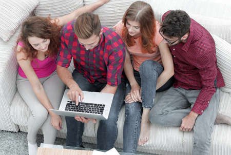group of friends with a laptop,discussing the videoの写真素材
