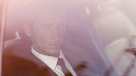 background image of the businessman in the car