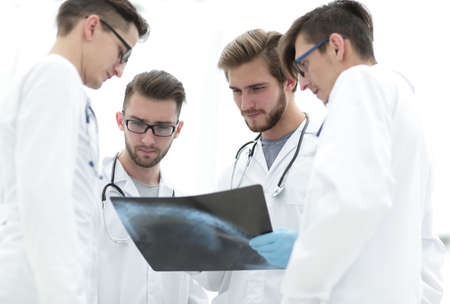 group of radiologists discussing x-ray