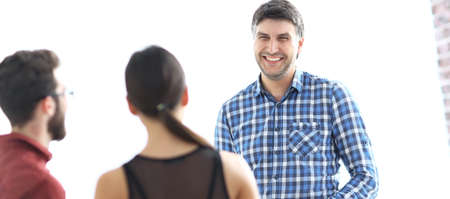 Portrait of confident businessman with colleagues, backgroundの写真素材