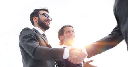 Cropped image of business people shaking hands