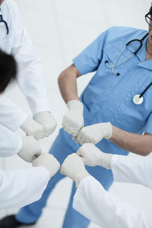 Doctors and nurses coordinate hands.の写真素材