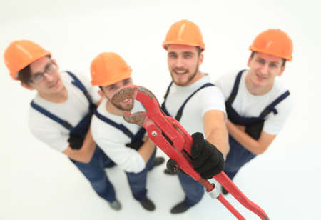 view from the top.the team of plumbers showing gas keysの写真素材