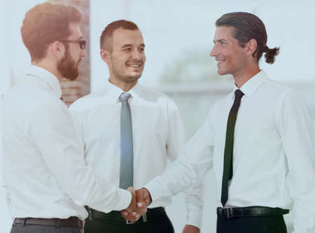 friendly handshake colleagues at a meetingの写真素材