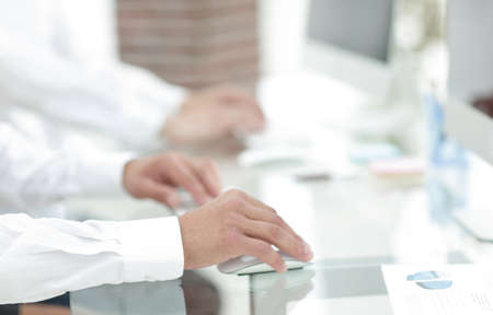 hands typing text on the computer keyboard. blurred business background.