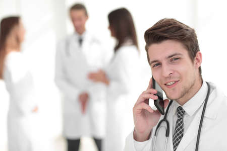 Dr. therapist is talking on the smartphone