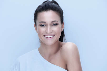 close-up portrait of a young womans face.の写真素材