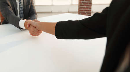 Successful businessmen handshaking after good deal.の写真素材