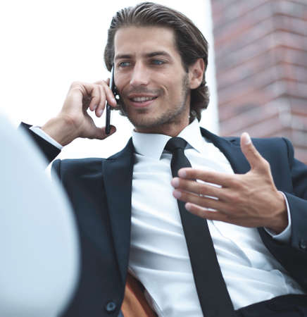 business man talking on smart phone.