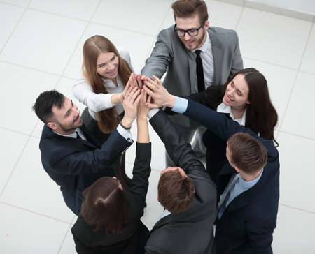 closeup. joyful business team with folded hands togetherの写真素材