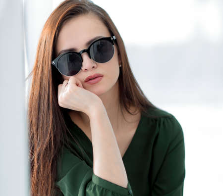 fashionable young woman in dark glassesの写真素材