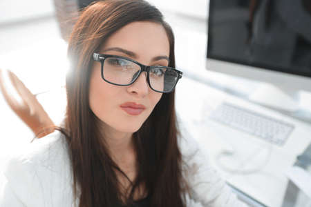 confident business woman sitting at her Deskの写真素材