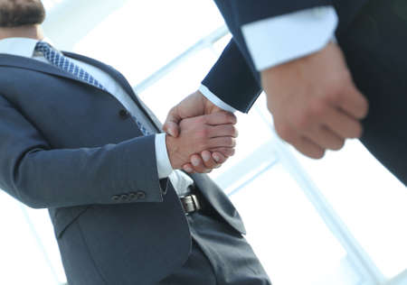 Business men shaking hands making an agreementの写真素材