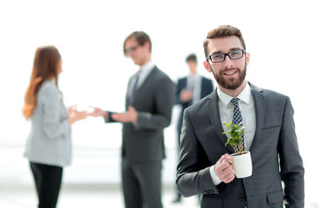businessman with green young escape on blurred backgroundの写真素材