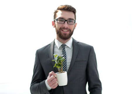 close up.businessman is holding a green young shootの写真素材