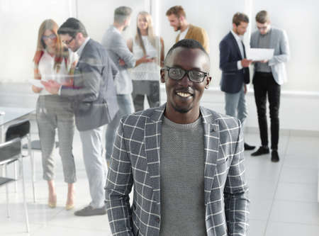 businessman standing in the hall of the modern office