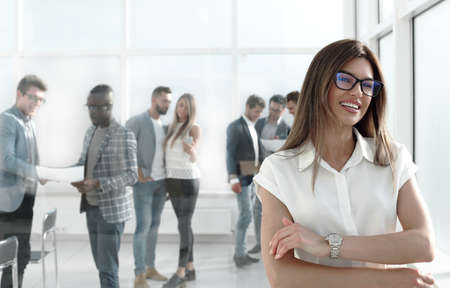 business woman and a group of employees standing in the officeの写真素材