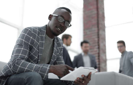 close up.a young businessman uses a digital tabletの写真素材