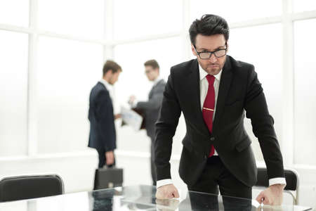 strict businessman standing in the conference roomの写真素材