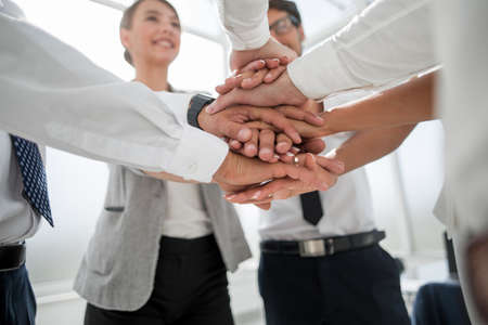 close up. business team with hands folded together
