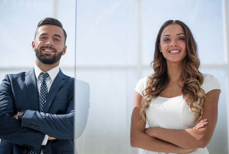 businessman and business woman on office window background
