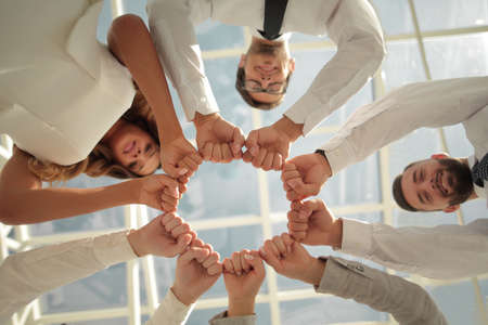 bottom view. business team standing in a circle.