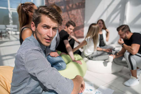 modern guy on the background of like-minded people