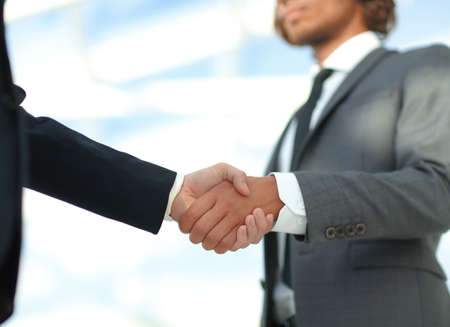 Business handshake and business people.
