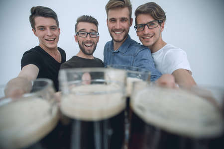 stylized photo .group of friends with beer mugsの写真素材