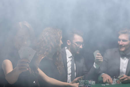 smiling woman with the winning combination of cardsの写真素材