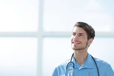 portrait of a friendly doctor in blue uniform.の写真素材