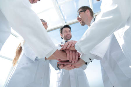 bottom view. close up of a doctors folded their hands togetherの写真素材