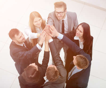 closeup. joyful business team with folded hands togetherの写真素材