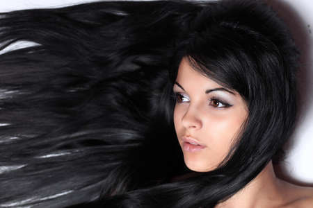 closeup of a female face. isolated on black.の写真素材
