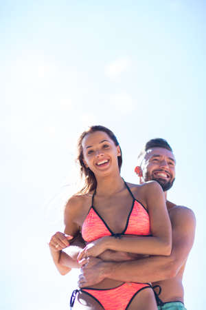 Romantic people in love running at sea.の写真素材