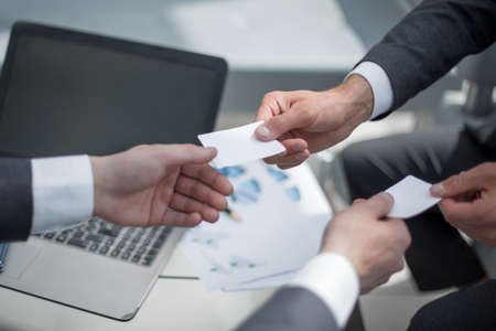 close up.business people exchanging business cardsの写真素材