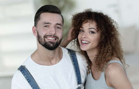 Happy young people standing in a new houseの写真素材