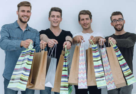 paper bags in the hands of a team of friendsの写真素材