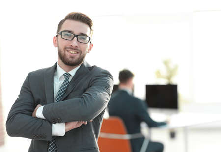 successful businessman on background of office