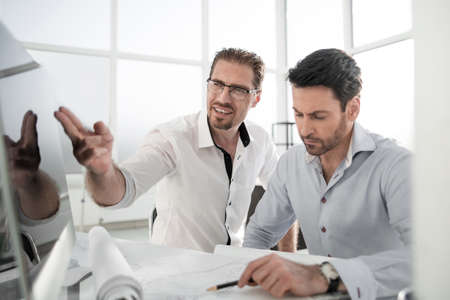 two architects discussing the project in the office