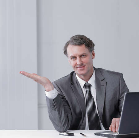 closeup . confident businessman pointing at copy space.の写真素材
