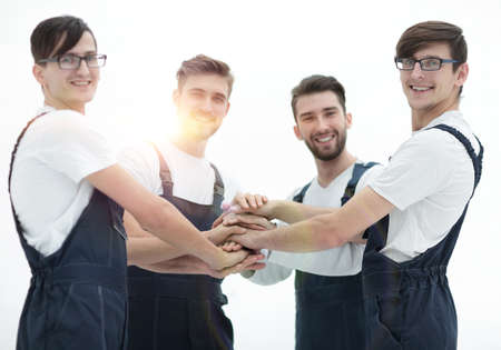 Team of movers joining hands.の写真素材