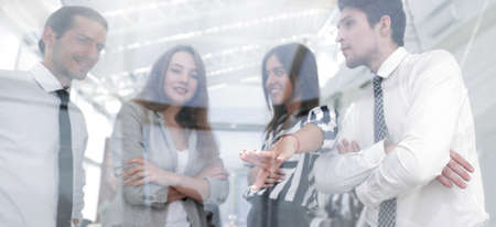 from behind the glass.successful business team
